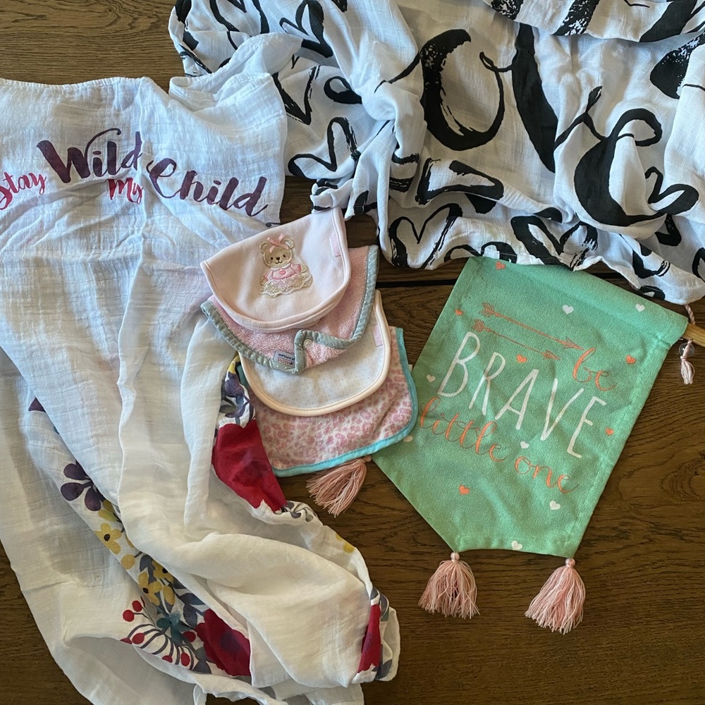 Assortment , milestone blanket, milk snob modern swaddle, bibs, hanging sign